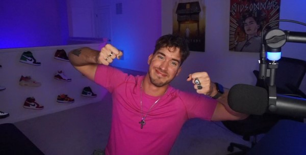 A guy with a bowl cut making the goatse pose